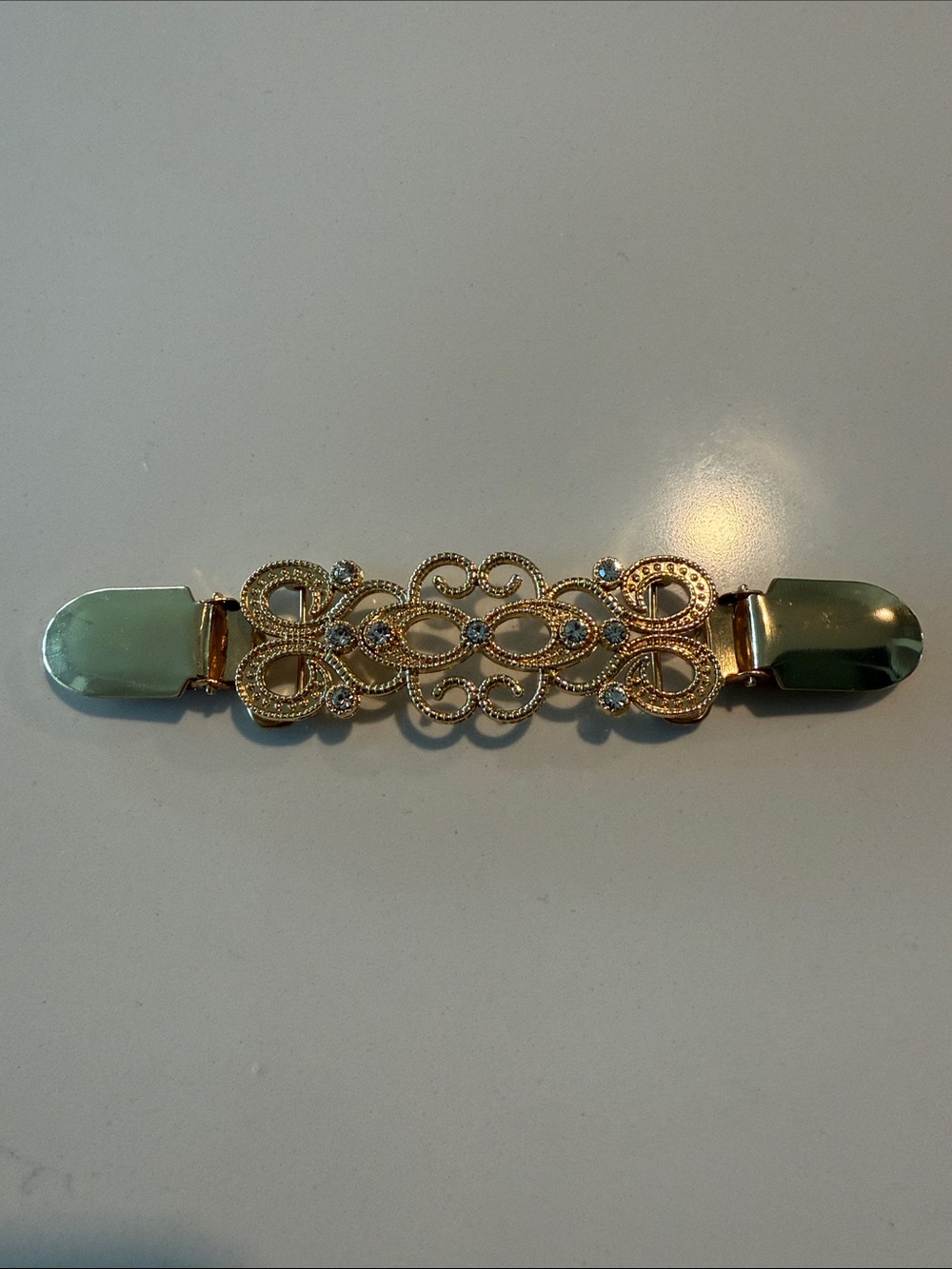 Gold Tone Sweater/ Dress Clip with White Stone
